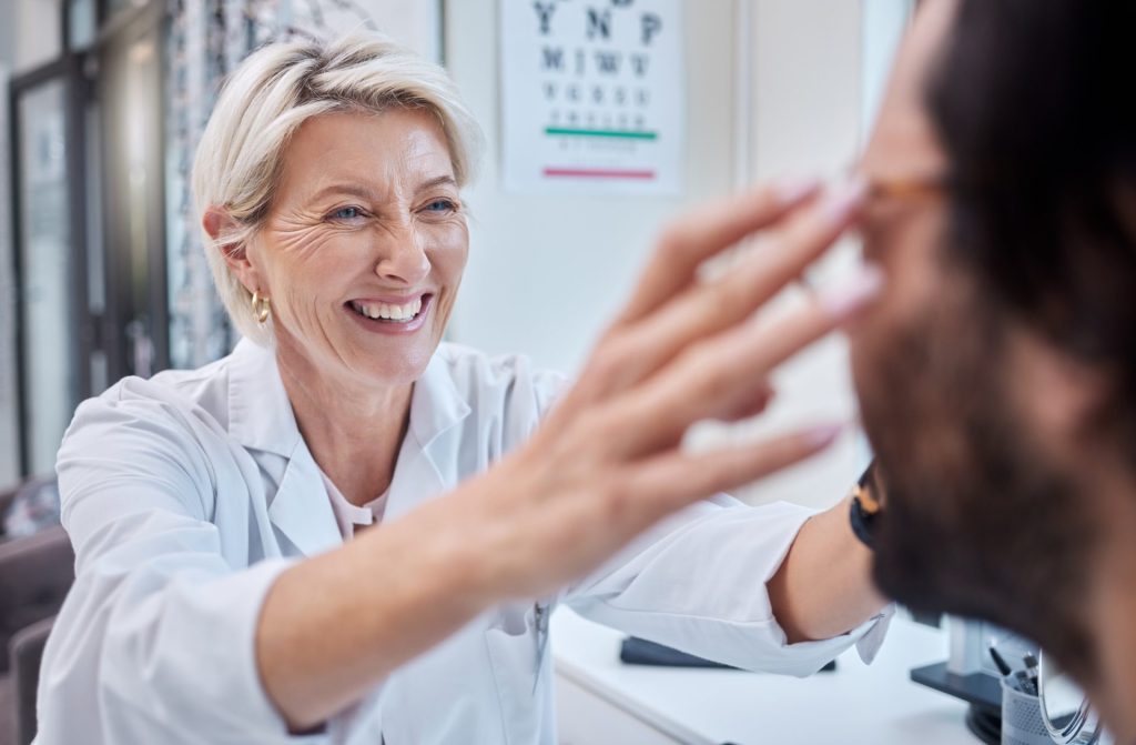Optometrist, woman and helping customer with eyes, glasses and vision in store. Face of happy optic