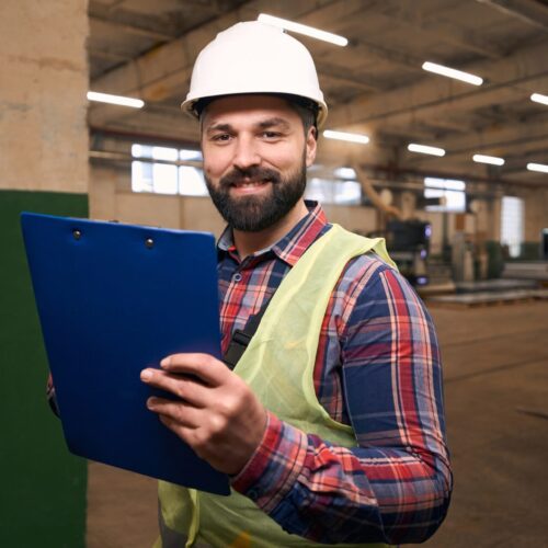 Portrait of builder working in the warehouse
